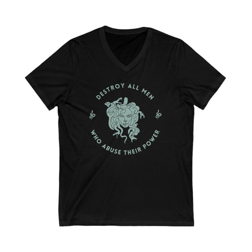 This black cotton v-neck shirt features a sea foam green Medusa head encircled by the words “DESTROY ALL MEN WHO ABUSE THEIR POWER” and snakes on either side. 