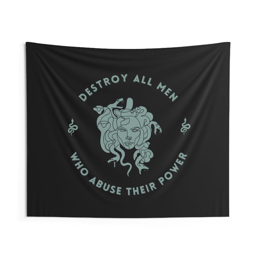 This tapestry is black and features a sea foam green Medusa head encircled by the words “DESTROY ALL MEN WHO ABUSE THEIR POWER” and snakes on either side.