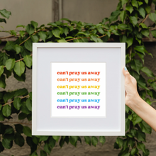 Load image into Gallery viewer, Framed art print that says “can’t pray us away” six times vertically laid out in rainbow font.
