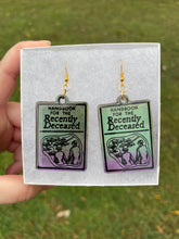 Load image into Gallery viewer, Green &amp; Purple Handbook of the Recently Deceased Earrings
