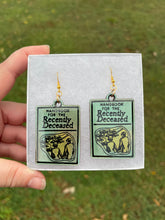 Load image into Gallery viewer, Green &amp; Gold Handbook of the Recently Deceased Earrings
