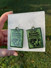 Load image into Gallery viewer, Dark Green Handbook of the Recently Deceased Earrings
