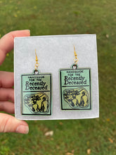 Load image into Gallery viewer, Green &amp; Gold Handbook of the Recently Deceased Earrings
